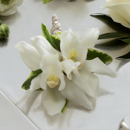 White Mini Cymbidium Boutonniere –  Blossom Shop, Conroe TX